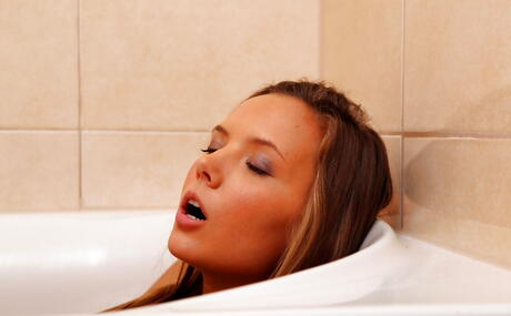 Attractive babe Katya Clover in sexy panties baring big boobies and toying her pussy in the bathroom